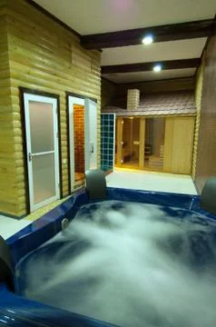 Swimming pool with jacuzzi Stock Photos