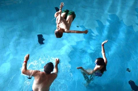 Swimming pool jumping Stock Photos