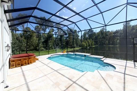 Swimming pool with lake view Stock Photos
