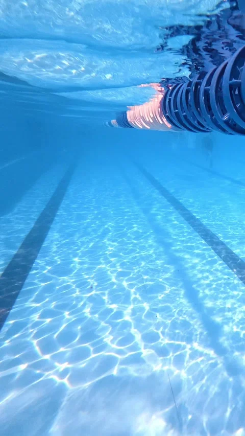 Swimming pool lane rope drifting underwater in outdoor lap pool Stock Footage 342157546