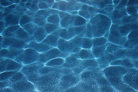 Swimming pool light patterns underwater Stock Photos
