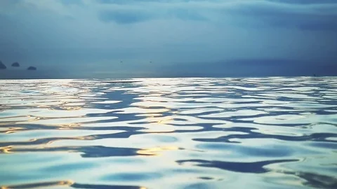 Swimming Pool on the mountain with infinity sea view during sunset. Slow motion Stock Footage 83133108