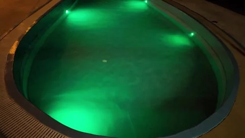 Swimming pool with multi-colored lighting Stock Footage 309128932