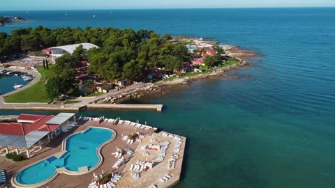 Swimming pool next to the sea stretching into the distance Stock Footage 161653487