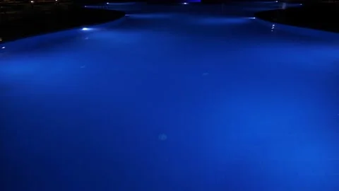 Swimming pool at night. close-up. pool water, blue backlit, at night Stock Footage 170706050