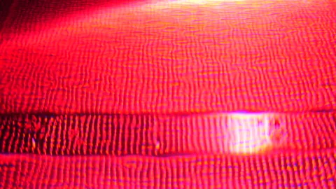 Swimming Pool at Night Colors Changing from Pink and Red to Orange Stock Footage 242302943