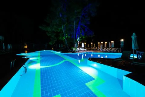 Swimming pool at night Stock Photos
