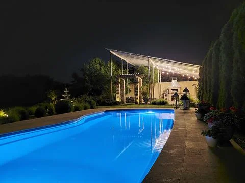 Swimming pool at night Stock Photos