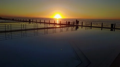 Swimming Pool At The Ocean At Sunset [Drone Footage] Stock Footage 88828992