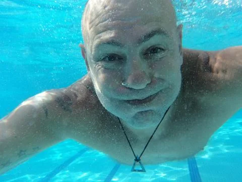 Swimming in the pool Stock Photos