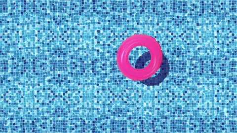 Swimming pool with pink inflatable donut Stock Footage 145281795