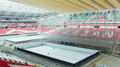 Swimming pool in process of construction under yellow roof Stock Footage 229842885