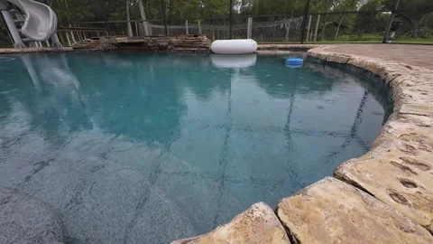 Swimming Pool With Rain Drops Falling On... | Stock Video | Pond5