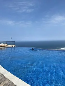 Swimming pool on the resort with panoramic skylight view Stock Photos