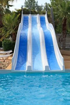 Swimming pool with slides Stock Photos