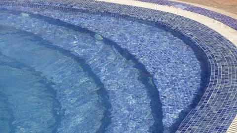 Swimming Pool Steps with Clear Blue Water in Slow Motion Video stock 340361916