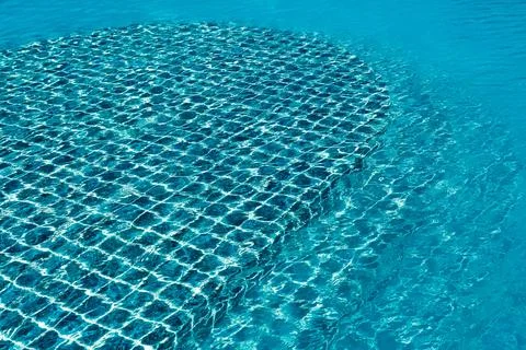 Swimming pool with sunny reflection Stock Photos