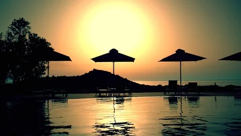 Swimming pool at sunset Stock Footage 72656600