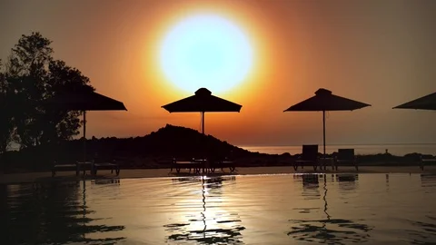 Swimming pool at sunset Stock Footage 90252835