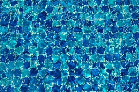 Swimming Pool Surface With Light Reflection and Water Ripple Patterns Stock Photos
