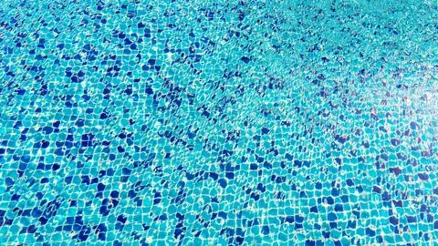 Swimming pool surface top view caustics ripple and flow with waves backgrou.. Stock Photos