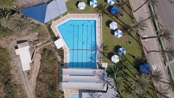 Swimming pool top shot with crane down Stock Footage 86038435
