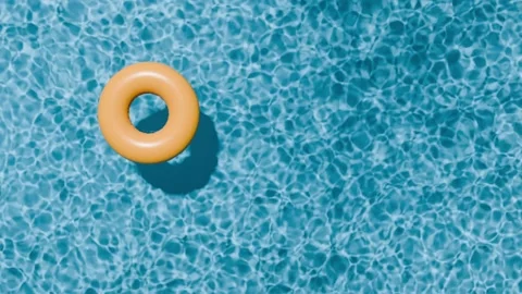 Swimming pool top view. Yellow swimming ring in the empty clear pool. Stock Footage 276435768