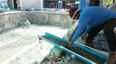 Swimming pool under construction, being sprayed on rebar for new swimming pool Stock Footage 59949066