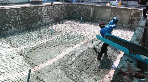 Swimming pool under construction, being sprayed on rebar for new swimming pool Stock Footage 59949252