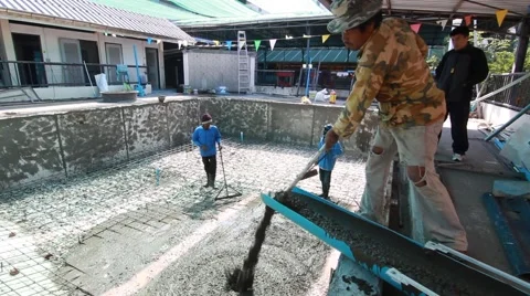 Swimming pool under construction, being sprayed on rebar for new swimming pool Stock Footage 59949342