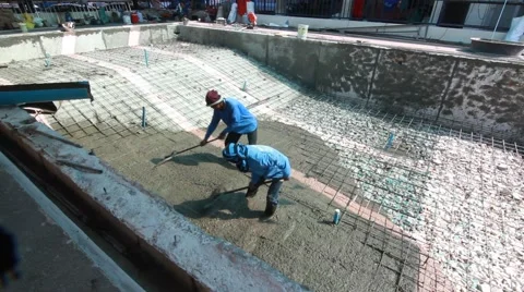 Swimming pool under construction, being sprayed on rebar for new swimming pool Stock Footage 59949434