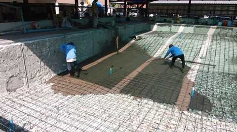 Swimming pool under construction, being sprayed on rebar for new swimming pool Stock Footage 59949579