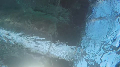 Swimming pool underwater directed towards water surface Stock Footage 55457774