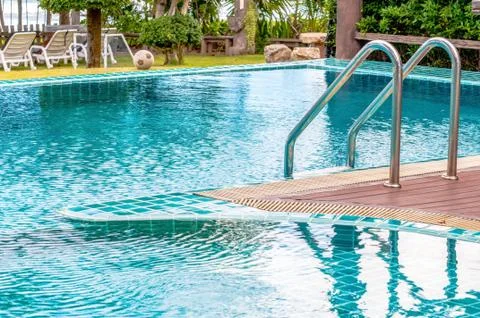 Swimming pool with view of garden Stock Photos