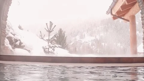 A swimming pool with views of snow-capped mountains Video stock 138510882