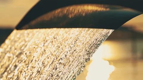 Swimming pool water fall on sunset Stock Footage 86090456