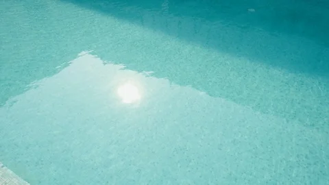 Swimming Pool water with mild waves sparkling under sunlight. 4K UHD video Video stock 101645892