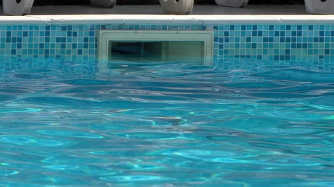 Swimming pool water surface with plastic water drainage channel Video stock 146100554