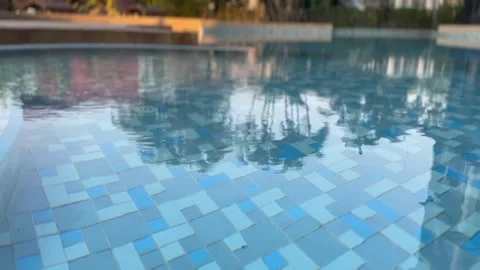 Swimming pool water surface with sunlight reflections Stock-Footage 312096685