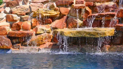 Swimming pool waterfall Stock Footage 24674436