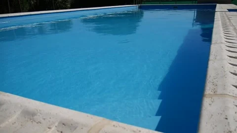 Swimming pool without people, blue, from the angle sunny day. Stock Footage 154309630