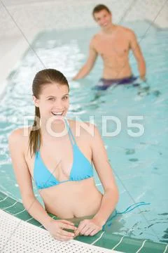 Swimming pool - young beautiful woman relax in bikini Stock Photos