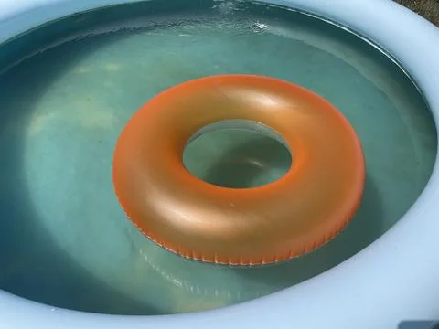 Swimming ring float in pool water Stock Photos