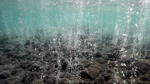 Swimming through bubbles caused by volcanic activity at Volcano Stock Footage 131140466