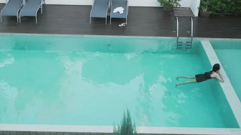 Swimming in a Tranquil Pool Stock Footage 314511041