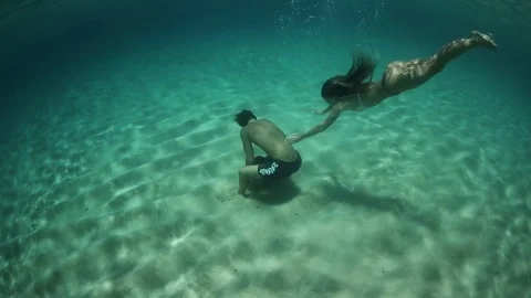 Swimming Underwater With Stockbeeldmateriaal 81933371