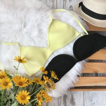 Swimsuits on the background of fur Stock Photos