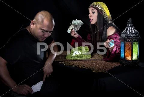 Swindler Gypsy Fortune Teller Committing Fraud Stock Photos