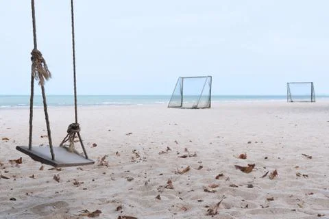 A swing and soccer goal on the beach Stock Photos