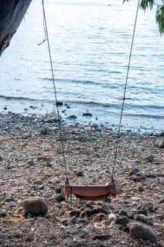 A swing attached to a tree and overlooking the Sea of Galilee Stock Photos